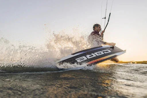 Kiteboarder carving on the Core Fusion 7 in flatwater at sunset near Tampa Bay.