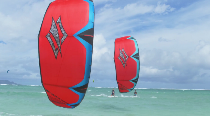 Naish Phoenix big air freeride kite flying over turquoise water