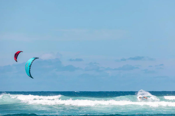 Two riders with naish Triad kites, riding the waves
